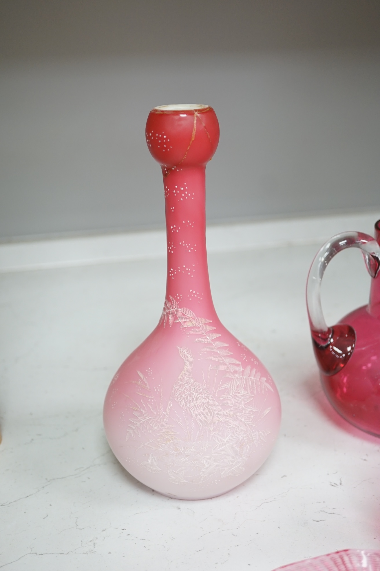 A pair of Victorian pink satin long necked vases, 25cm high, and five pieces of cranberry coloured glassware, (8). Condition - fair to good.